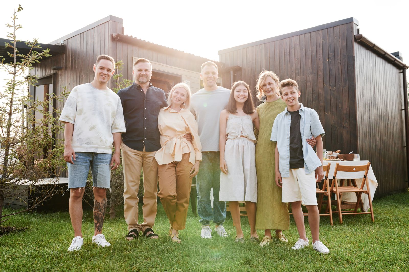 Family gathered outdoors in the sun